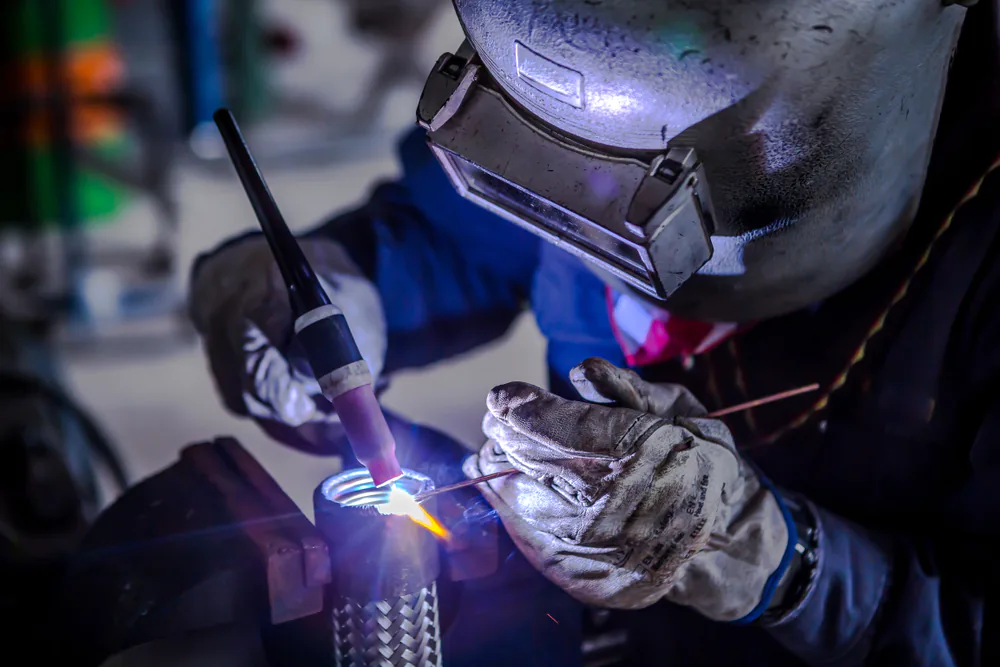 Welder performing tig welding