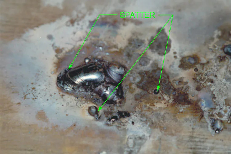 hard weld spatter fused to base