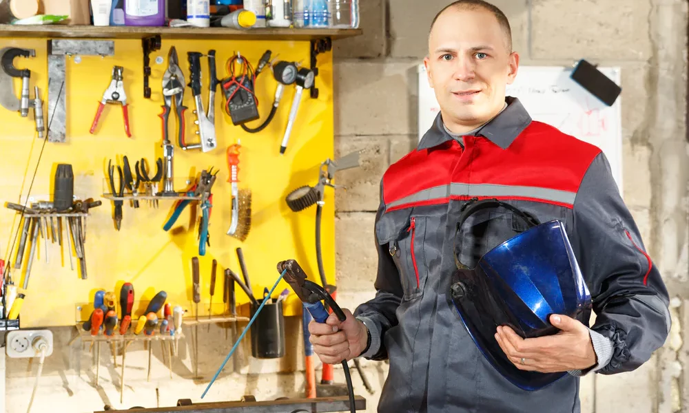 welder standing in welding shop