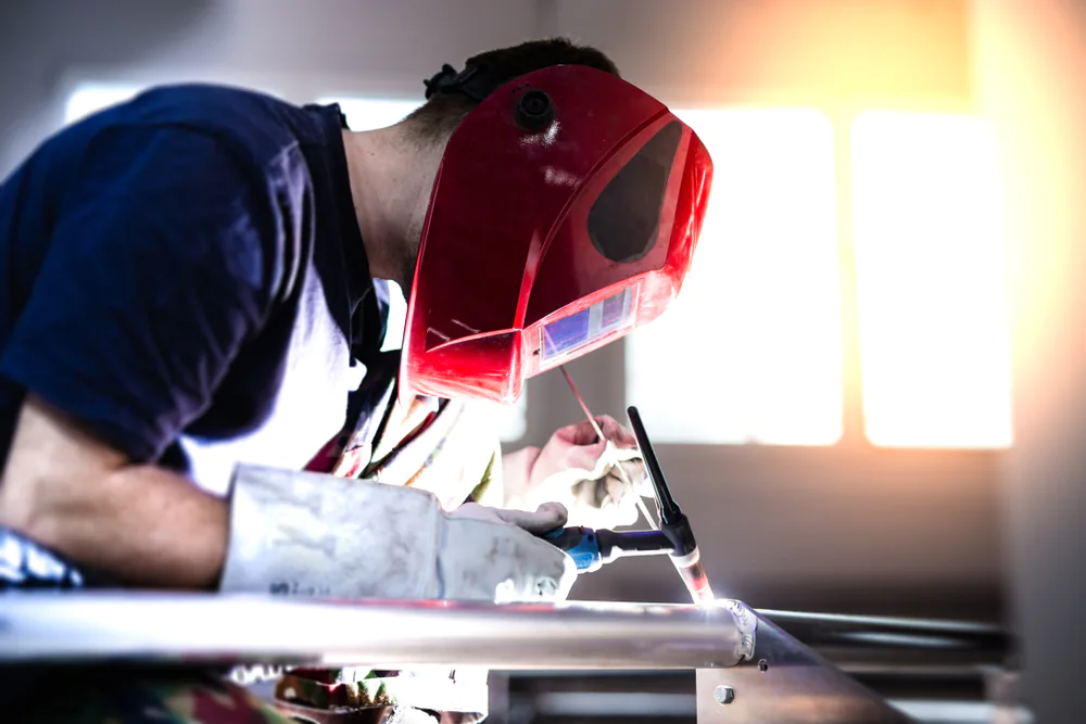 welding performing tig welding