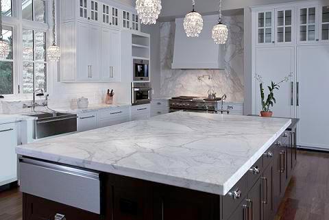 Marble looking countertop of a beautfiul white slate color kitchen