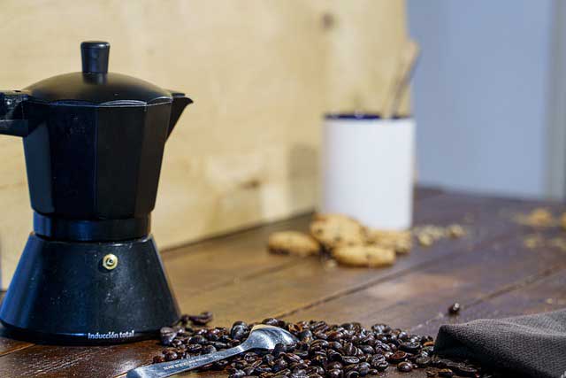 black coffee machine with a coffee beans.