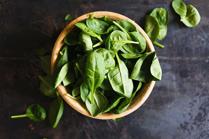 Fresh green herbs in a clay pot